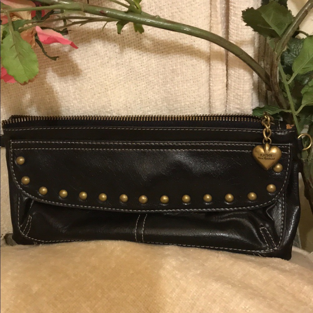Kathy Van Zeeland  Brown leather clutch